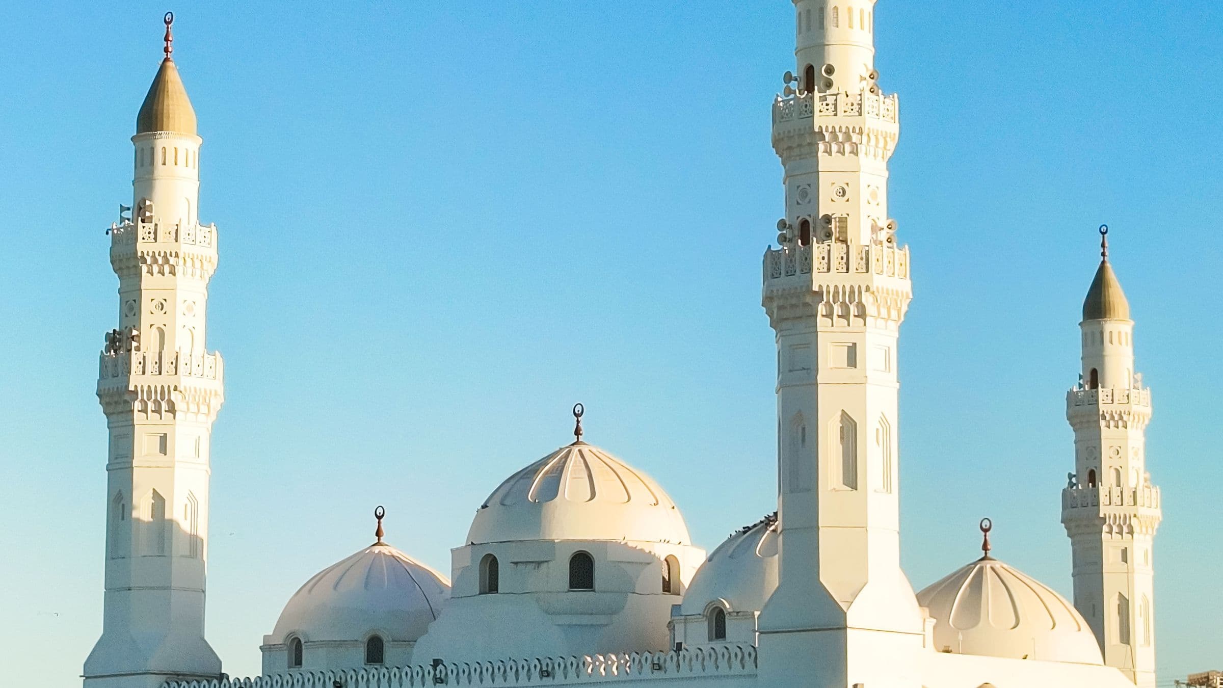 The white domes and minarets of Quba Mosque