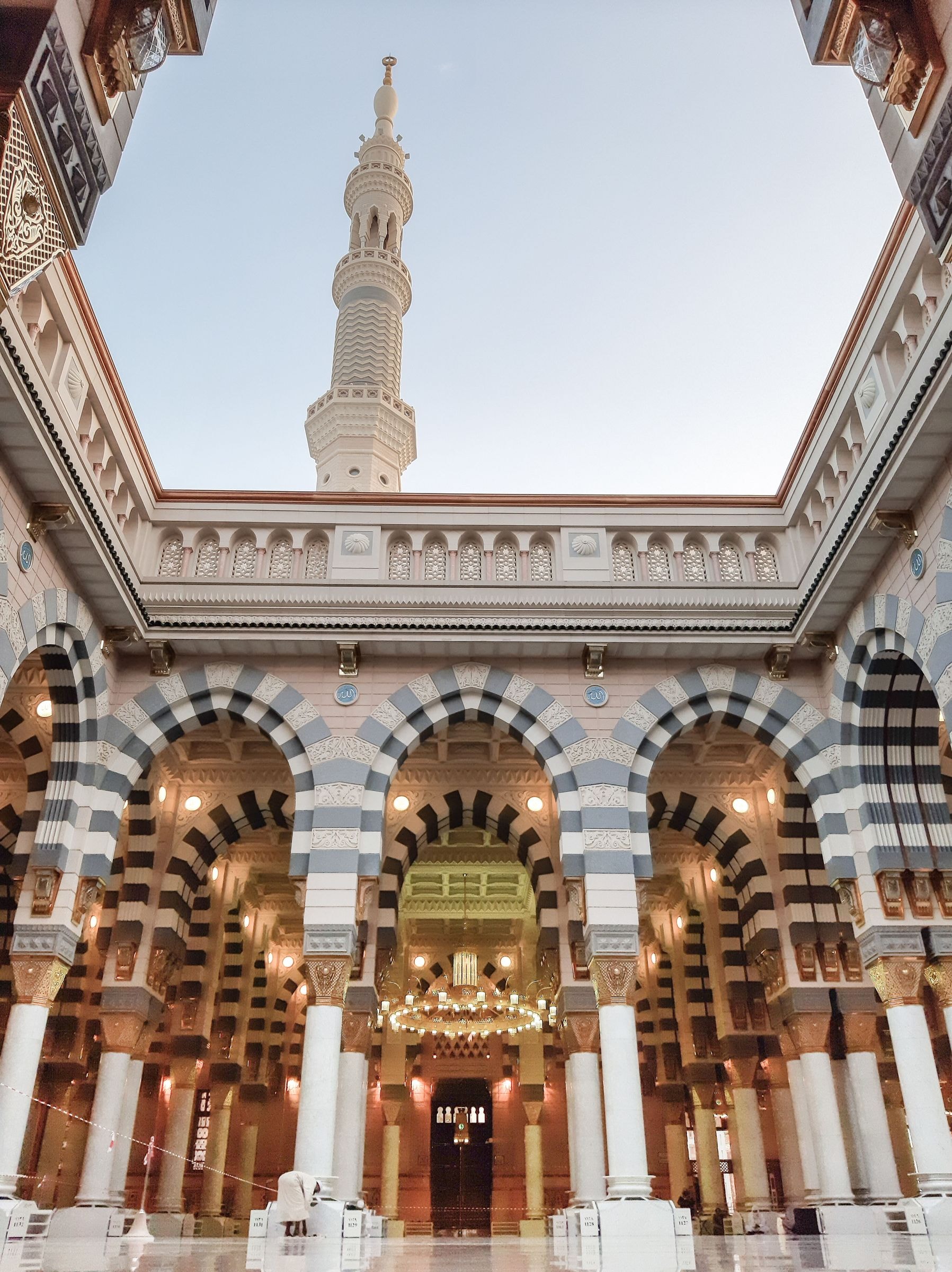 Arches and a minaret in the inner courtyard of the Prophet's Mosque