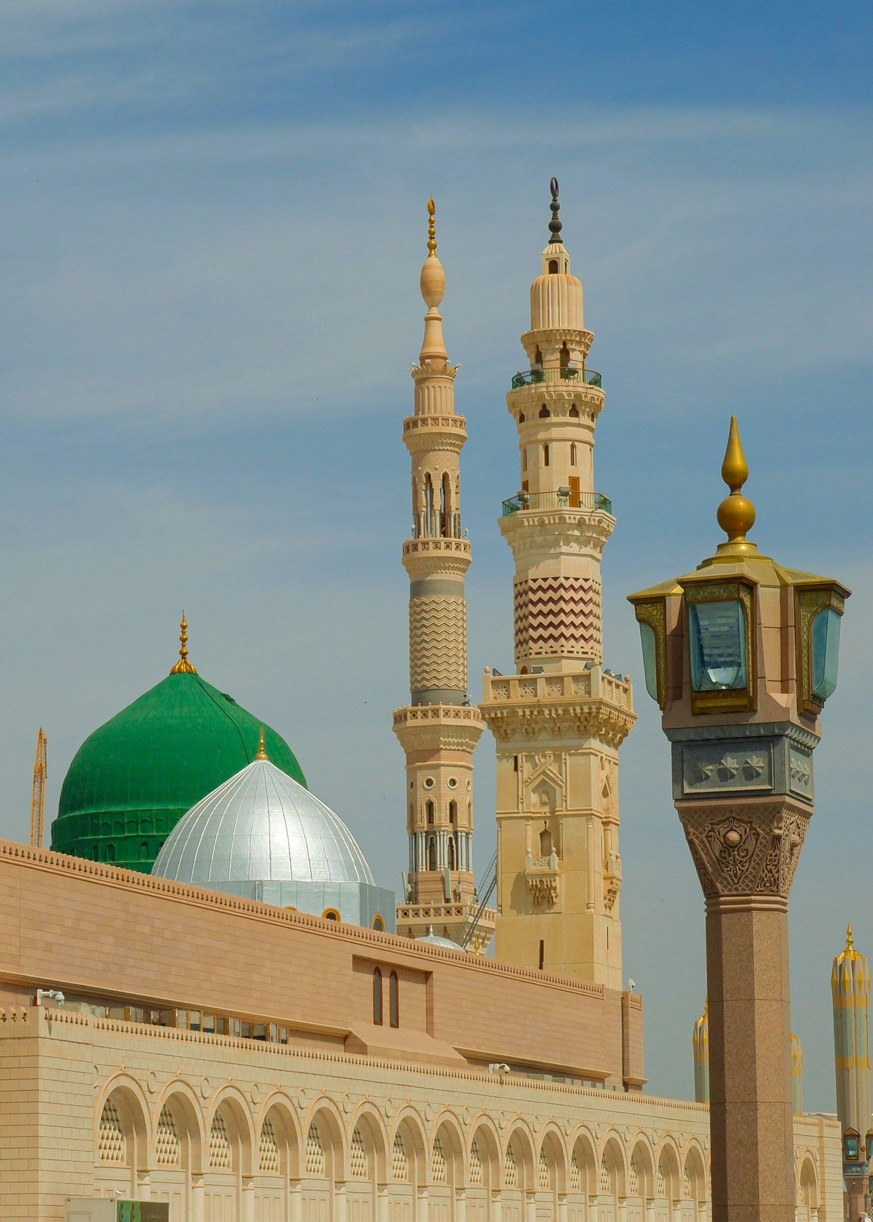 Green Dome and silver dome with minarets and lantern, blue sky